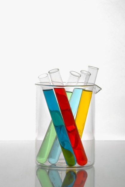 Free photo lab glassware with colored substance arrangement