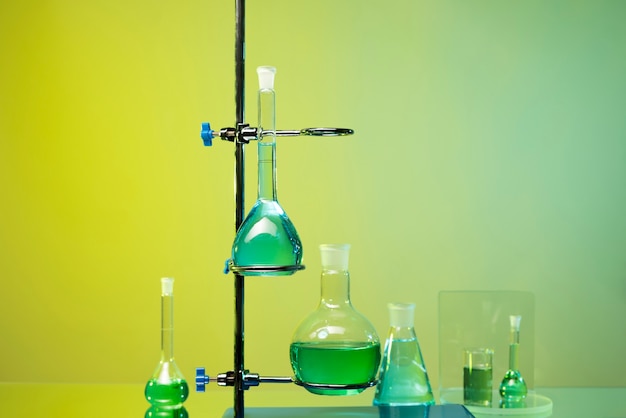 Laboratory glassware arrangement with green liquids