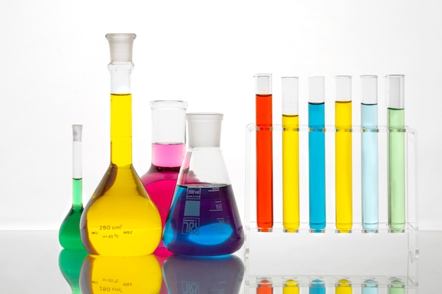 Laboratory glassware containing colorful liquid on table