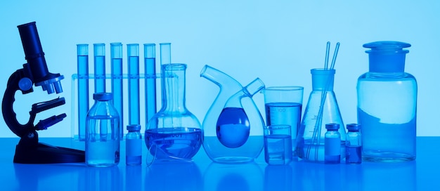 Free photo laboratory glassware and microscope arrangement