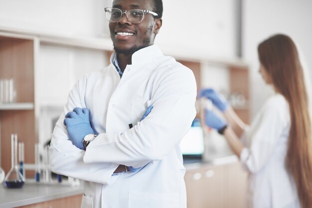 Laboratory laboratories conduct experiments in a chemical laboratory in transparent flasks. Output formulas.