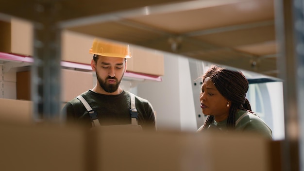 Laborers preparing warehouse shipping