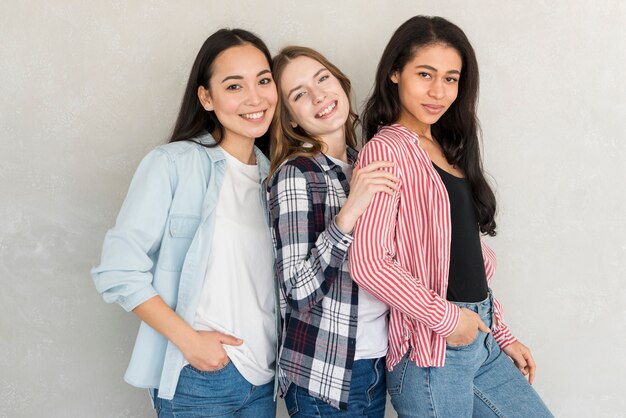 Ladies standing together smiling and looking at camera