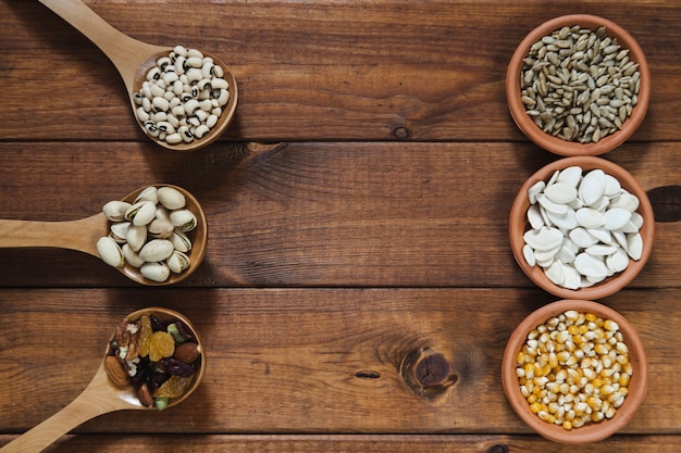 Ladles and bowls with nuts and seeds