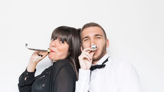 Lady and guy in evening wear with party flutes