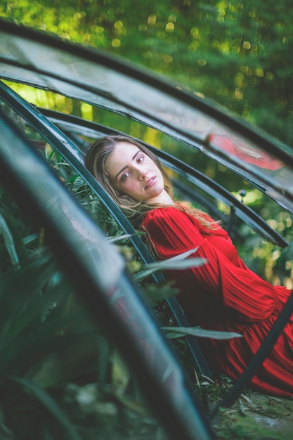 Lady in red looking at camera