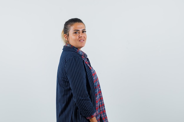 Free photo lady in shirt, jacket looking at camera and looking pretty .