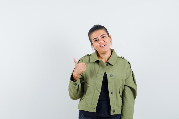 Lady showing thumb up in jacket