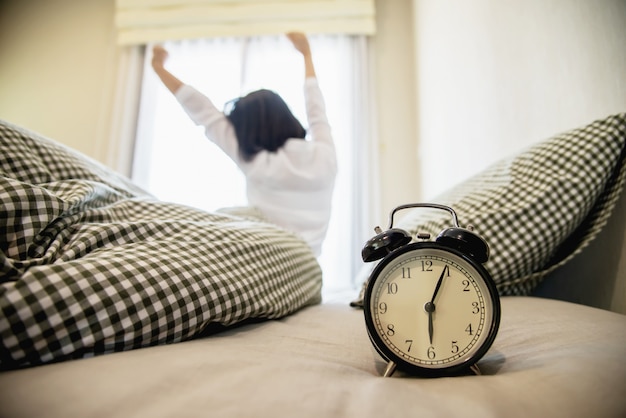 Free photo lady wake up stretch oneself lazily for fresh morning