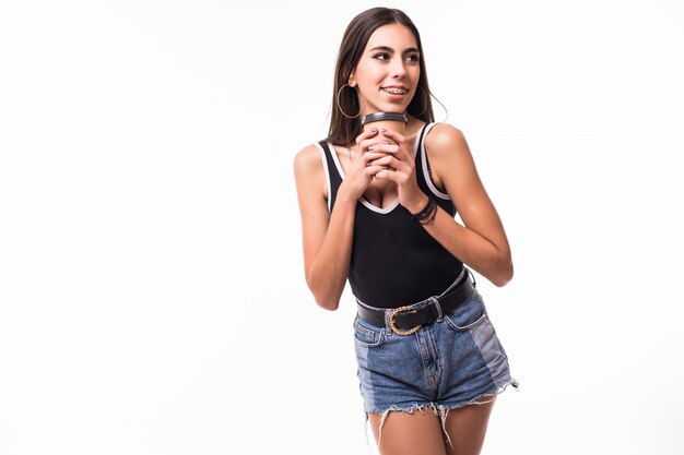 Lady with brunette hair holds coffee cup in her hands isolated