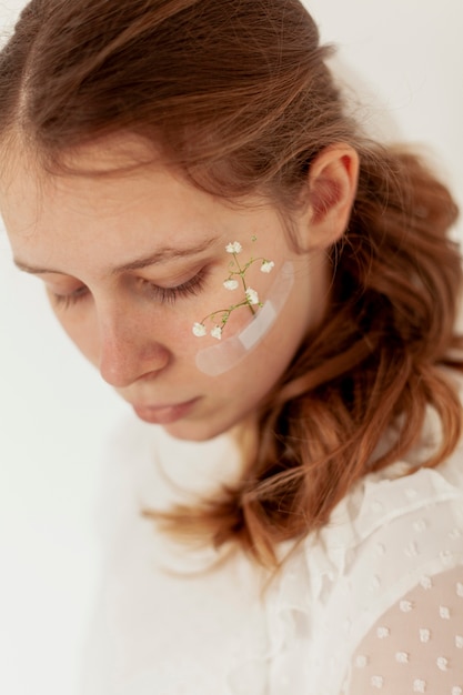 Lady with flowers on face