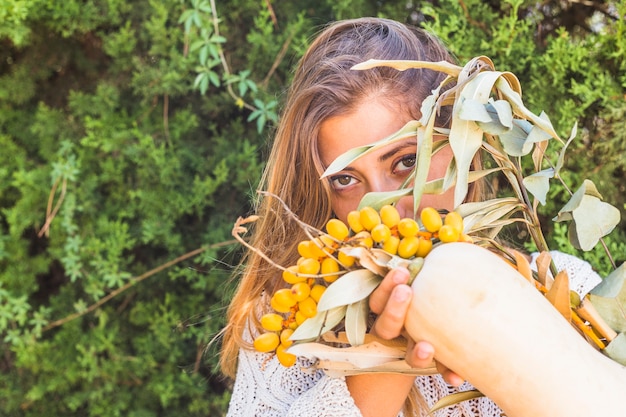 Lady with sandthorn berries and marrow