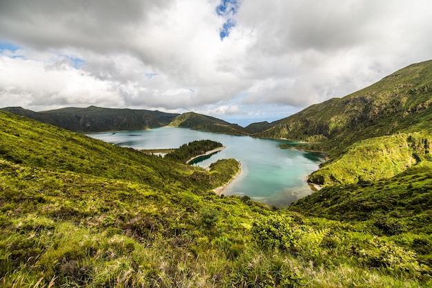 Lagoa do Fogo, a volcanic lake in Sao Miguel, Azores Island under the dramatic clouds