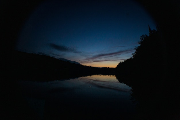 Lake before sunset and reflection of sky