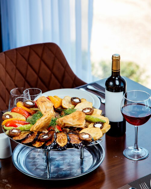 Lamb saj with aubergine, mushroom, tomato, pepper and flatbread