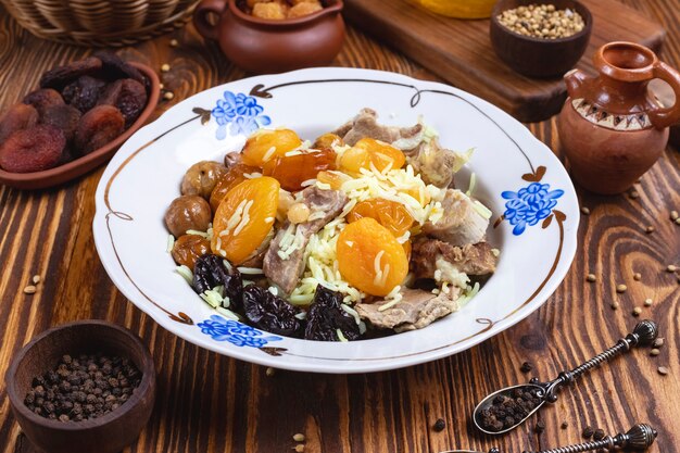 lamb with rice dry fruits chestnuts prunes spices side view