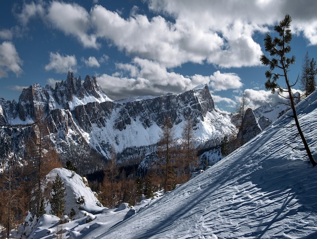 landscape of dolomites covered in the snow under the sunlight in the italian alps