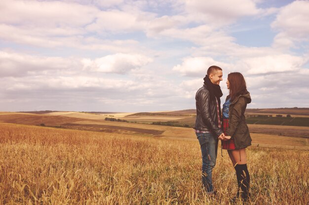 Landscape portrait of young beautiful stylish couple sensual and having fun outdoor
