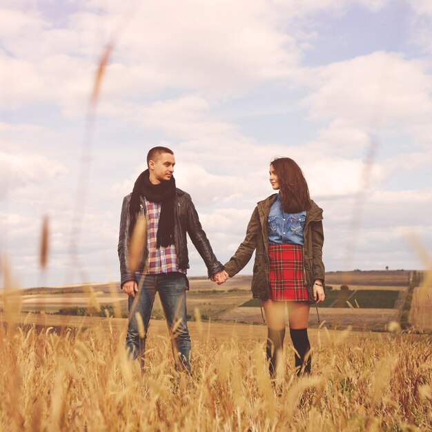 Landscape portrait of young beautiful stylish couple sensual and having fun outdoor