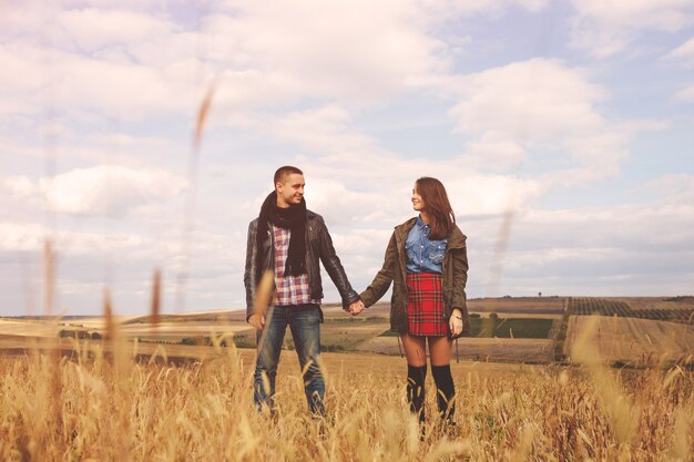 Landscape portrait of young beautiful stylish couple sensual and having fun outdoor