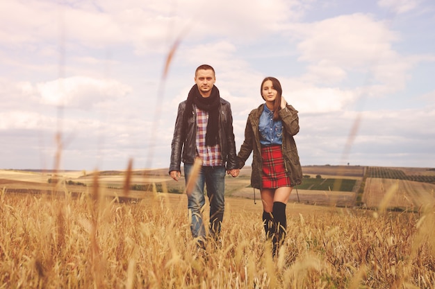 Landscape portrait of young beautiful stylish couple sensual and having fun outdoor