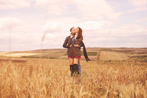 Landscape portrait of young beautiful stylish couple sensual and having fun outdoor