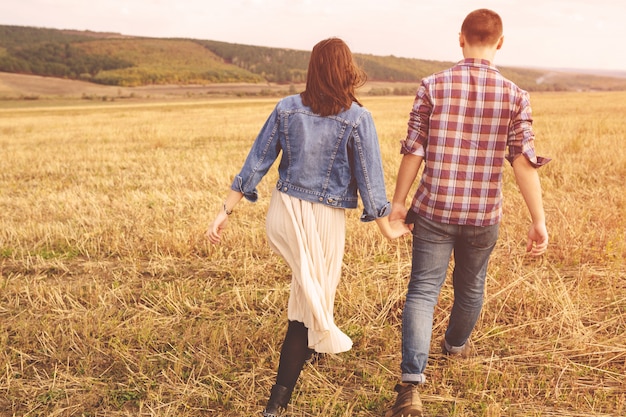 Landscape portrait of young beautiful stylish couple sensual and having fun outdoor