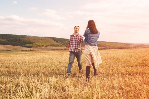 Landscape portrait of young beautiful stylish couple sensual and having fun outdoor