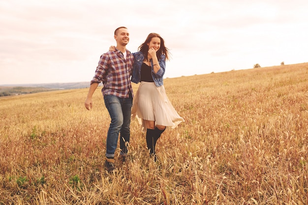 Landscape portrait of young beautiful stylish couple sensual and having fun outdoor