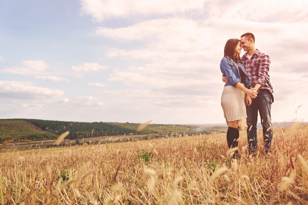 Landscape portrait of young beautiful stylish couple sensual and having fun outdoor