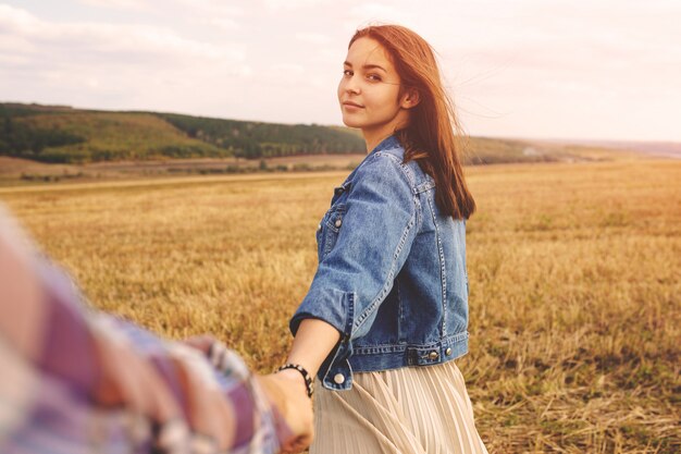 Landscape portrait of young beautiful stylish couple sensual and having fun outdoor