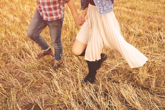 Landscape portrait of young beautiful stylish couple sensual and having fun outdoor