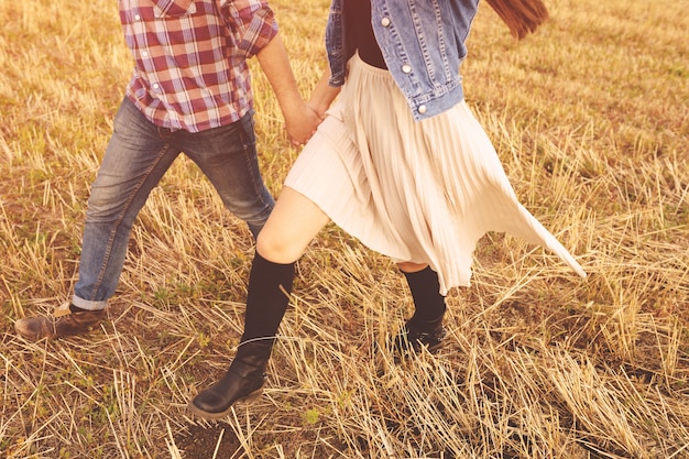 Landscape portrait of young beautiful stylish couple sensual and having fun outdoor