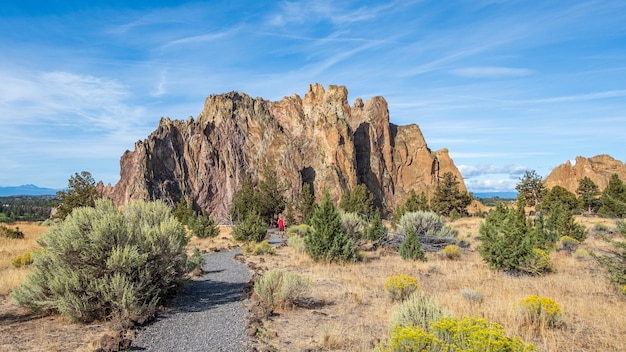 Landscape of rocks and greenery in the Smith Rock State Park under a blue sky in Terrebonne, the US