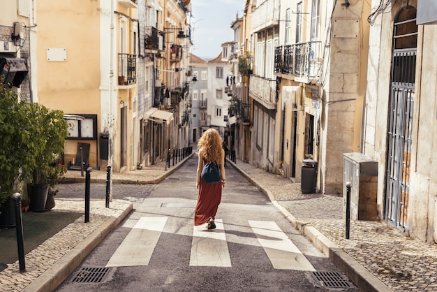 A landscape shot of a young female traveler