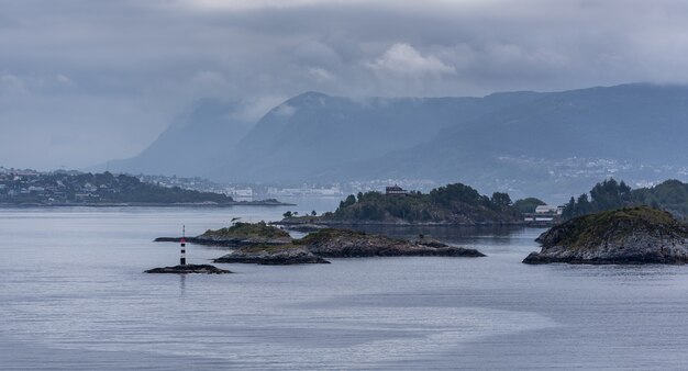 Landscape view of Akureyri, Iceland with mountains in background under a cloudy sky