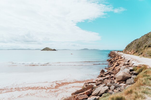 Landscape view of the beach in Rio near the sandy road