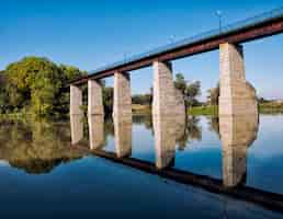 Free photo landscape with brick bridge