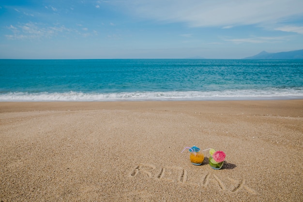 Landscape with ocean and composition on sand