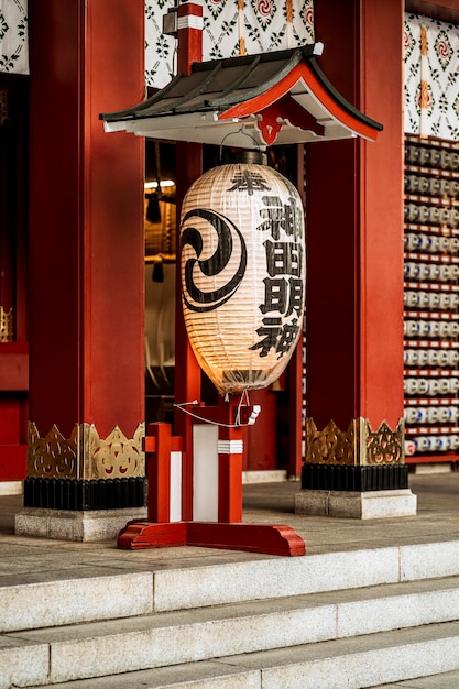 Free photo lantern hanging at the entrance of japanese temple