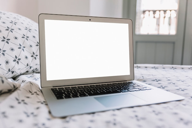 Laptop on bed