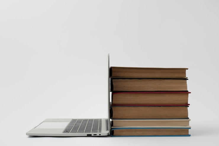 Free Photo laptop and books arrangement