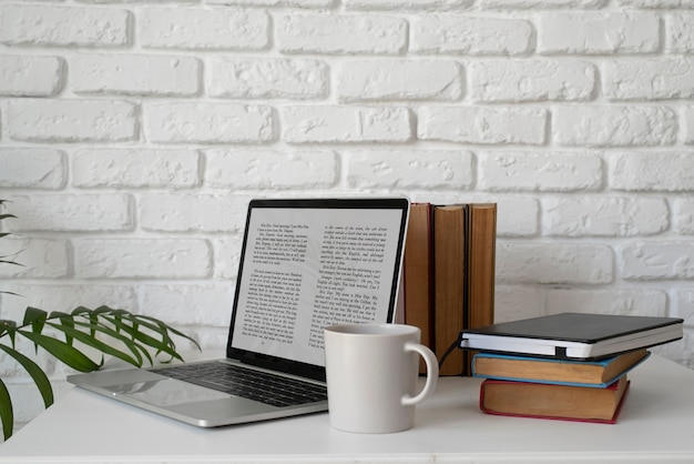 Free photo laptop and books arrangement