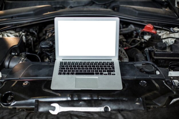 Laptop on a car engine