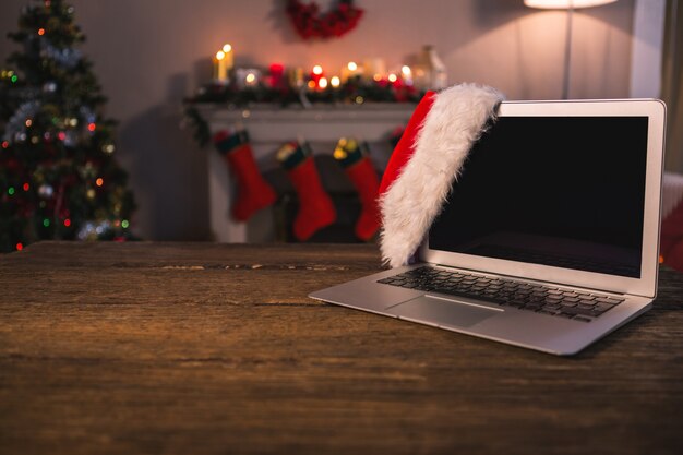 Laptop on the floor with a santa hat