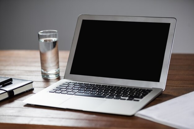 Laptop and glass of water