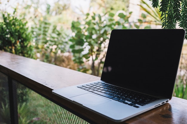 Laptop on graden fence