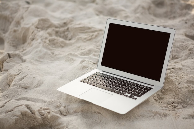 Laptop kept on sand