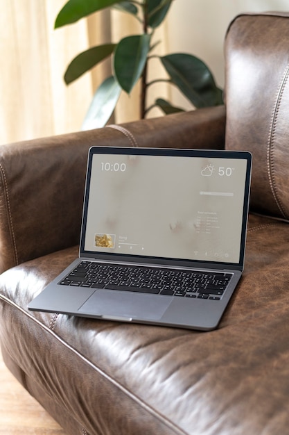 Laptop on a leather couch
