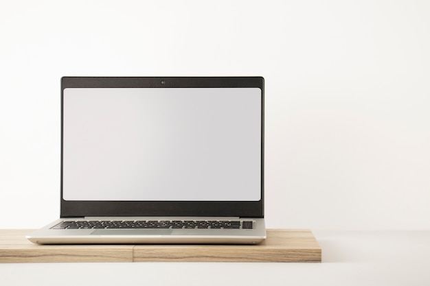 Laptop minimal display on wooden board